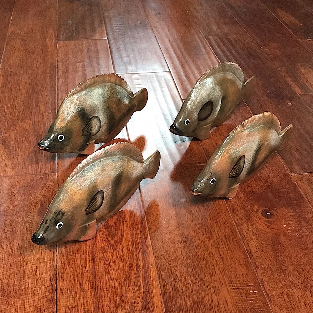 Four Hand-Painted Brown and Black Wooden Fish